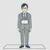 胸に大きな名札を下げて正面に立つ会社員のイラスト