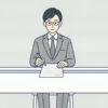 机に向かってペンを持ったまま、目の前の一枚の紙に手を止めている会社員のイラスト
