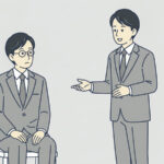 椅子に座った会社員に、立っている人が手を差し出して話しかけているイラスト